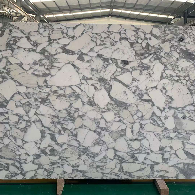 Grande sporgenza del pavimento del tavolino da caffè in pietra naturale in marmo bianco